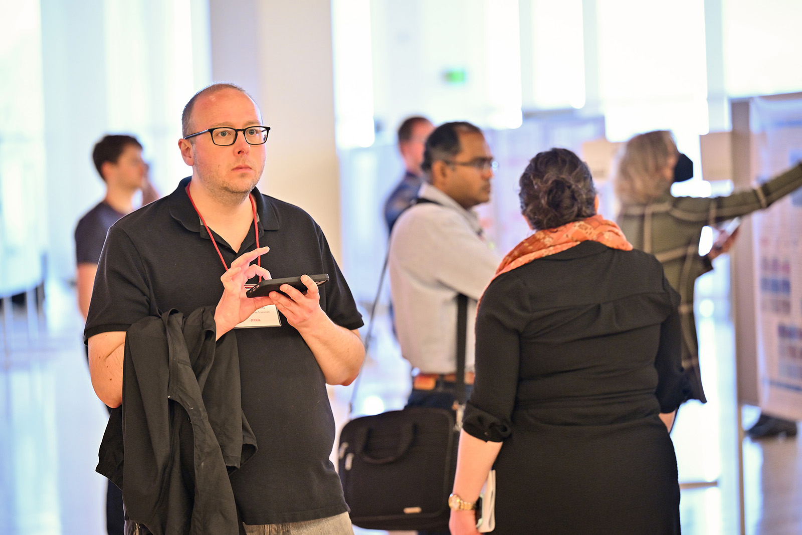 SURCA 2023 judges evaluate posters at the beginning of the annual event.