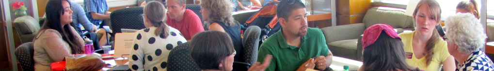 Students discuss course material in groups.