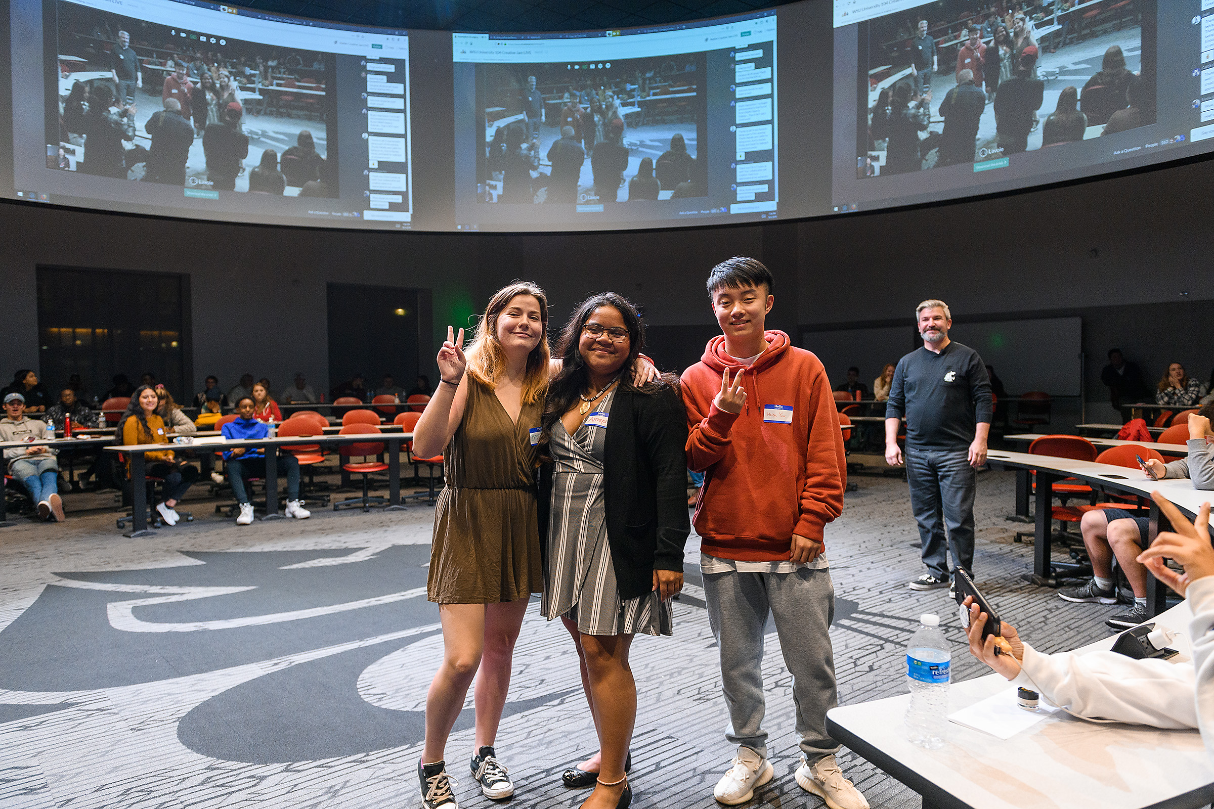 First-place winners Bryn Rosemore, team leader Amaya Kaipat, and Hsien-you Chao pose for the camera at the conclusion of the 2019 Abobe Creative Jam at Washington State University.