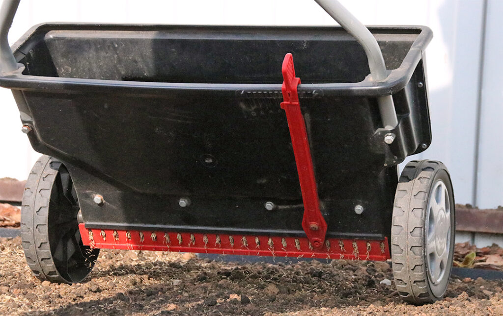 Closeup view of a drop fertilizer spreader