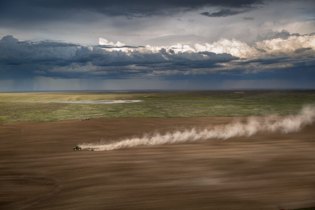 A tractor driving through a field.