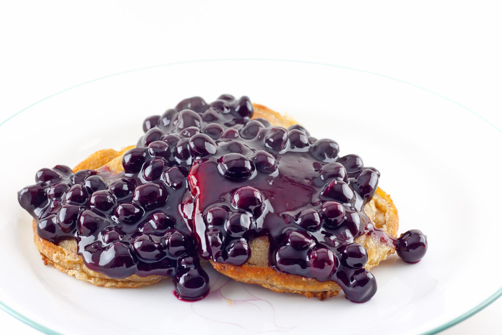 Blueberry pie filling on pancakes.