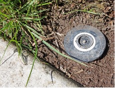 Round black sprinkler head.