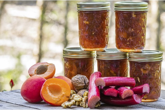 A group of jars of jam and fruits