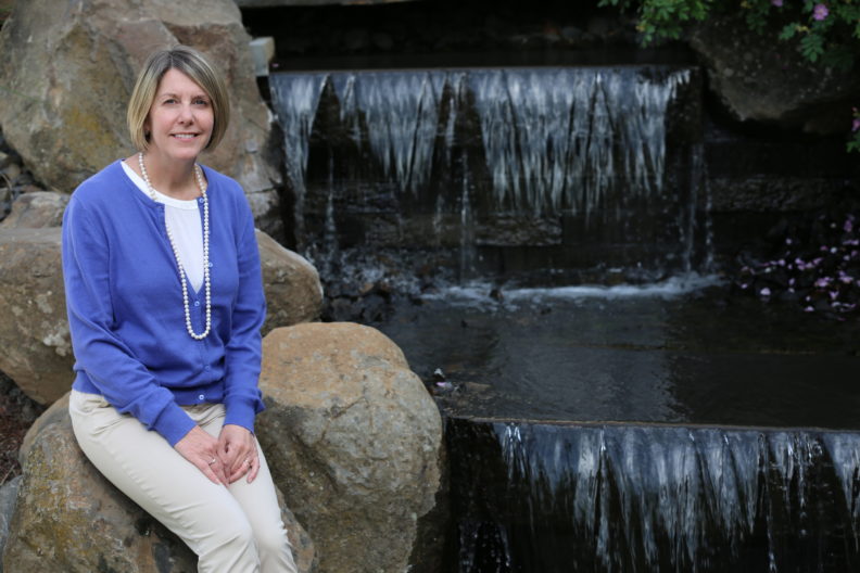 Kathy Nitta smiling at camera.