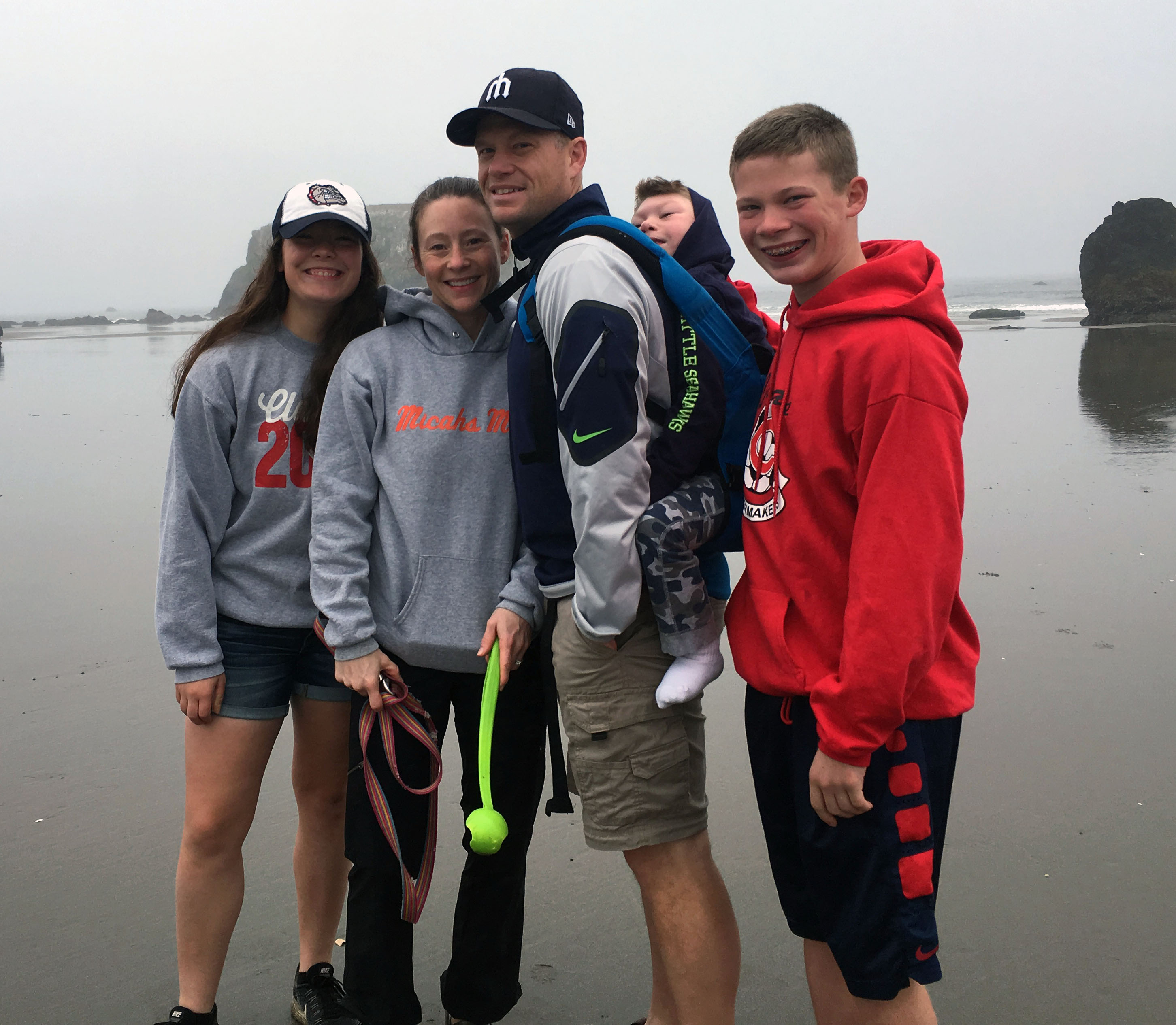 Micah with his whole family on the beach