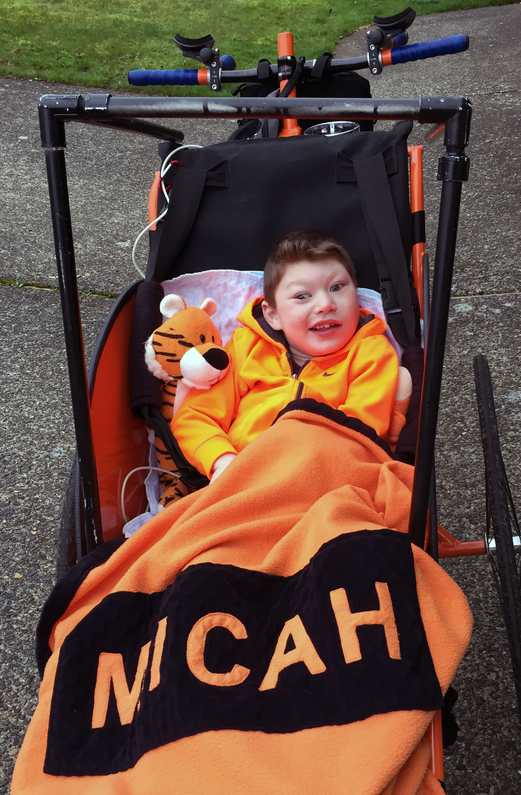 Micah sitting in bicycle front cart