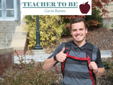 Gavin Barnes giving a thumbs up sign in front of Cleveland Hall.