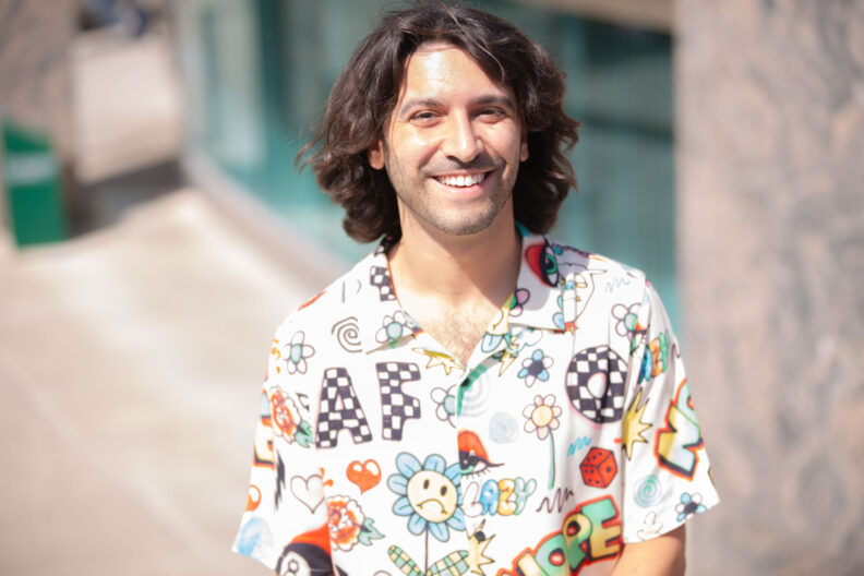 Tristan Loria in front of the Holland Library