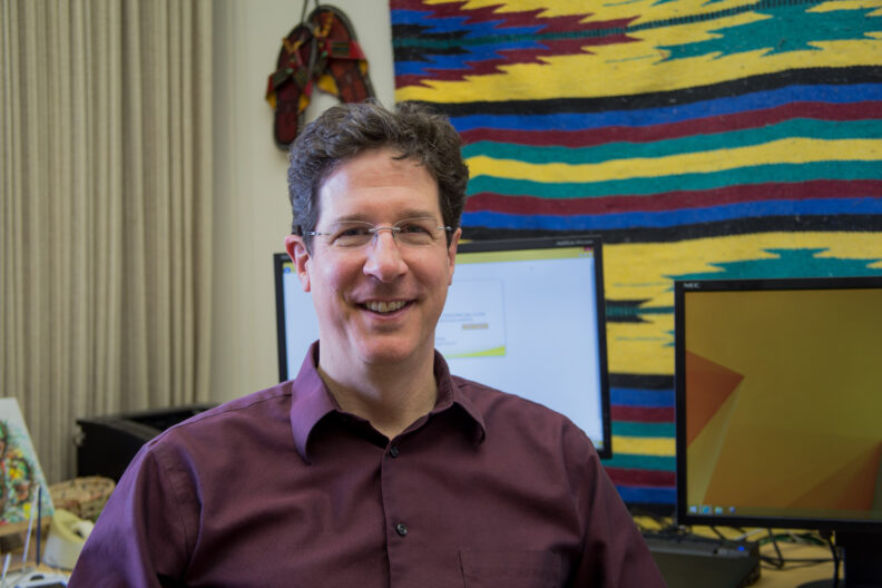 Tom Salsbury smiling at camera.