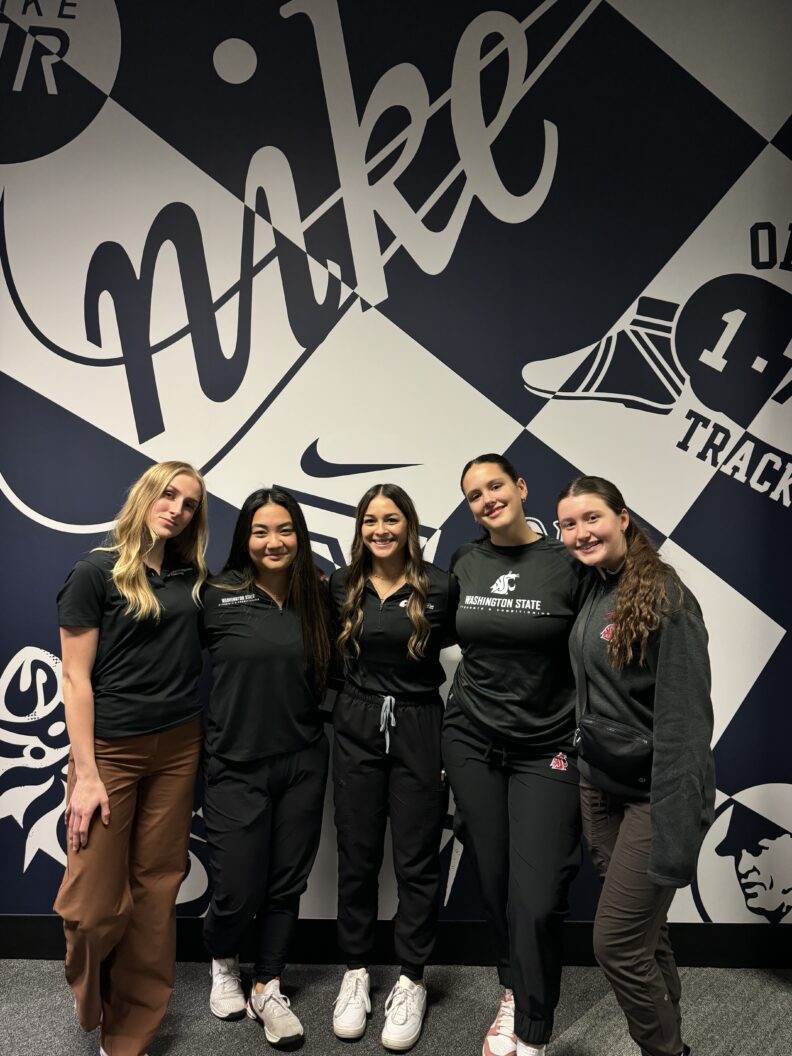 Photo of Strength and Conditioning students, all smiling at camera.