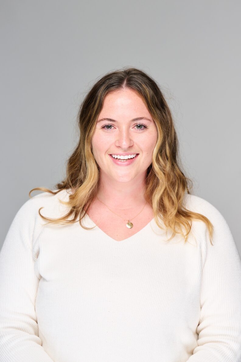 Monica McNamara smiling at camera.