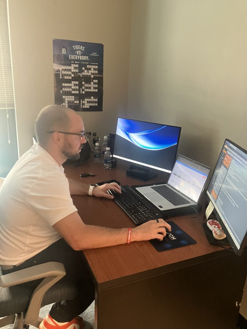 Colin typing at his desk.