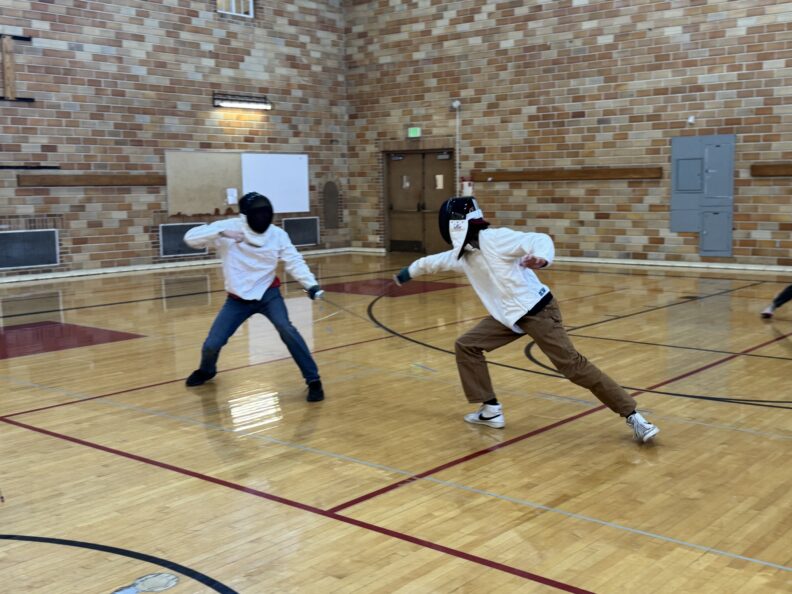 two woman Fencing