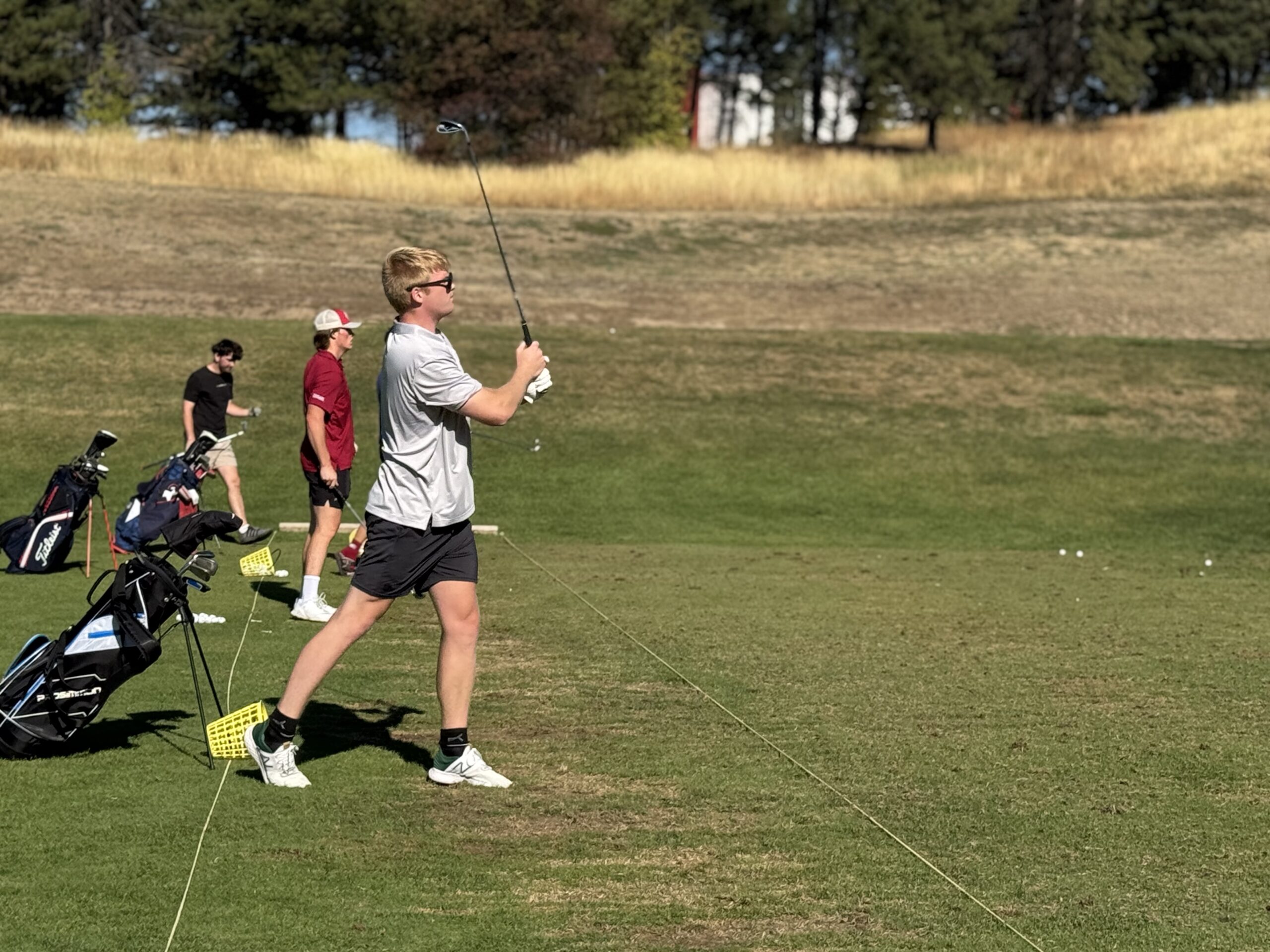 A lady holding a golf club
