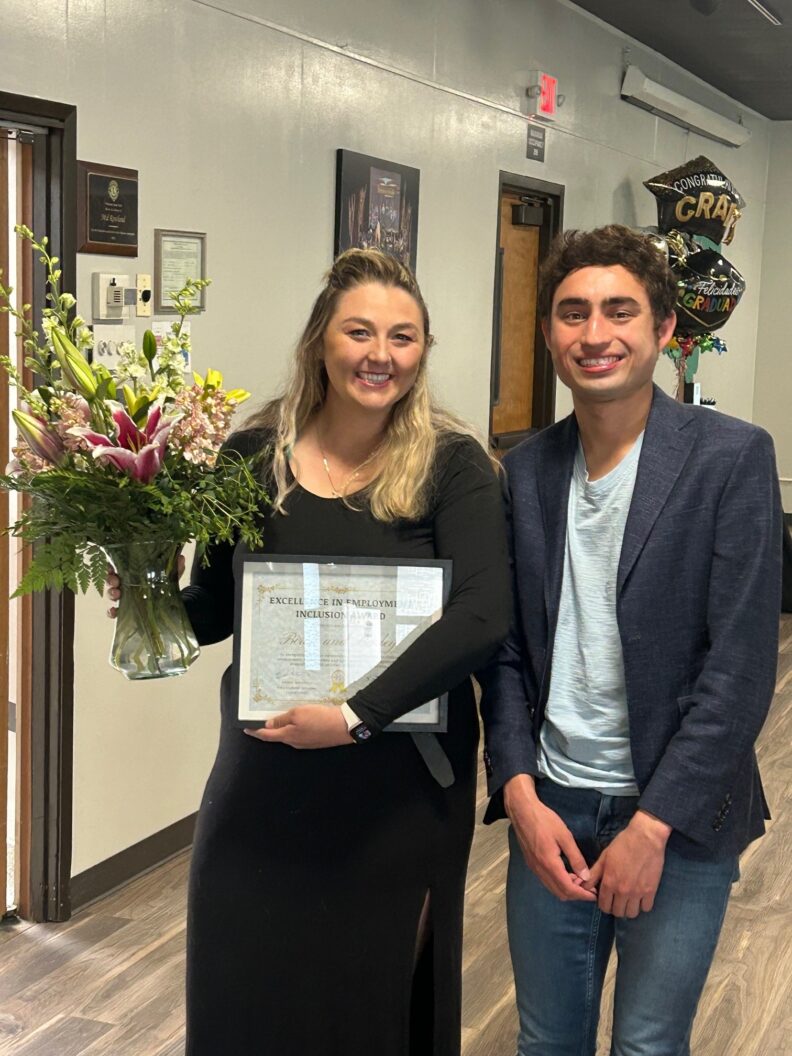 ROAR Student, Justin Braza with Hannah Sprague, Birch & Barley Manager, at the End of the Year ROAR Showcase.
