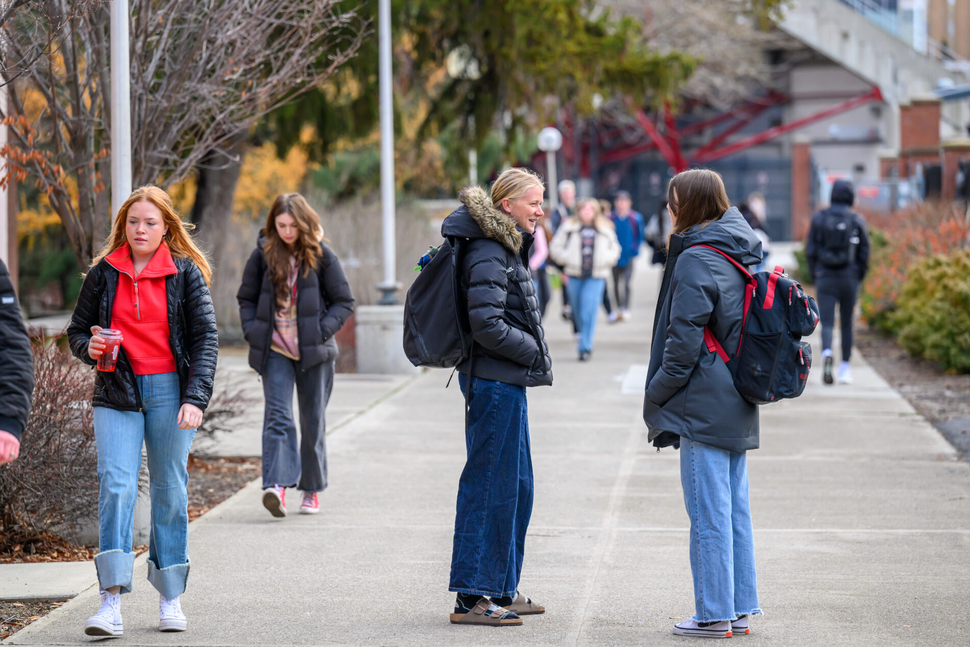 Students walking two girls talking