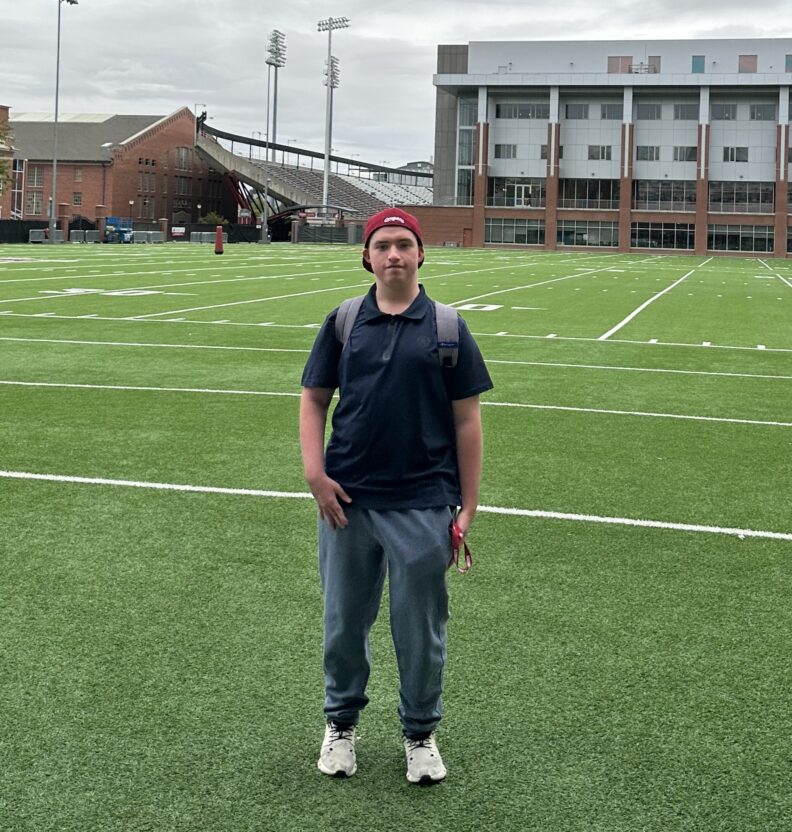 ROAR Scholar Dawson Holthaus outside the Cougar Football Complex