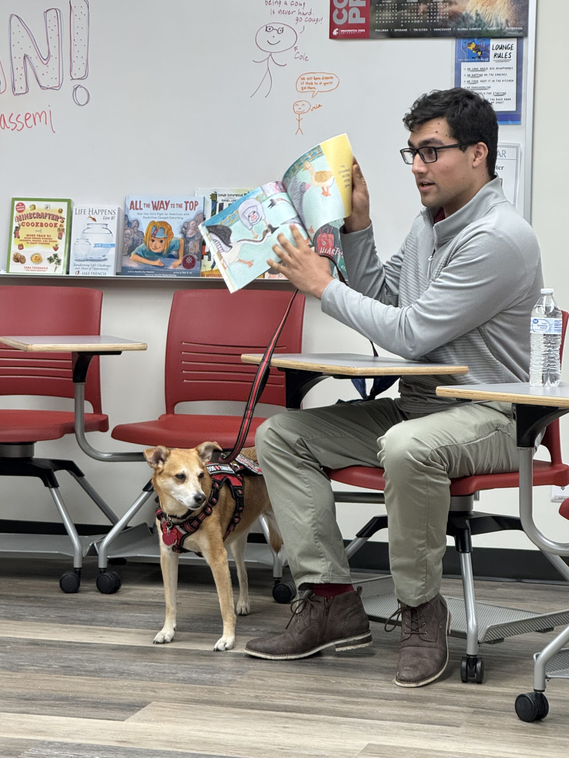 Arshan Ghassemi reading this children's book to ROAR Scholars
