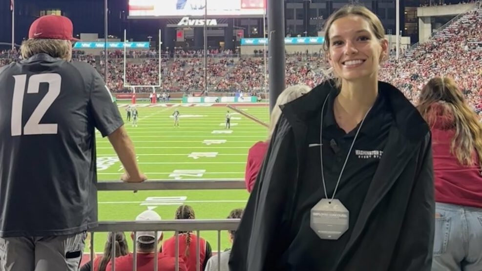 A photo of Dominique Phelps, a female WSU Student. She is pictured at a WSU football game at Gesa Field in Pullman, Washington. 