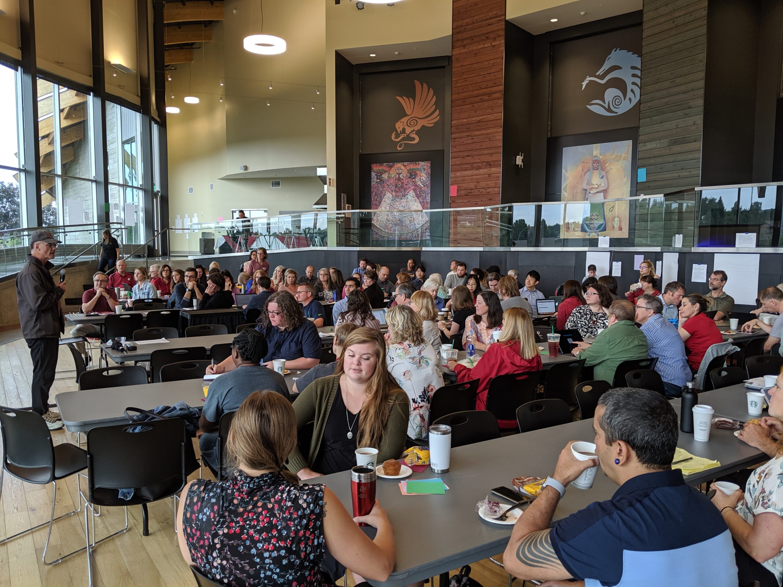 Group of people mingling in the Elson Floyd Visitors Center.