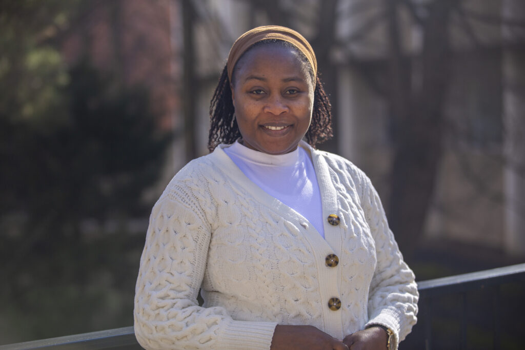Oluyemisi Oloniyo smiling at camera.