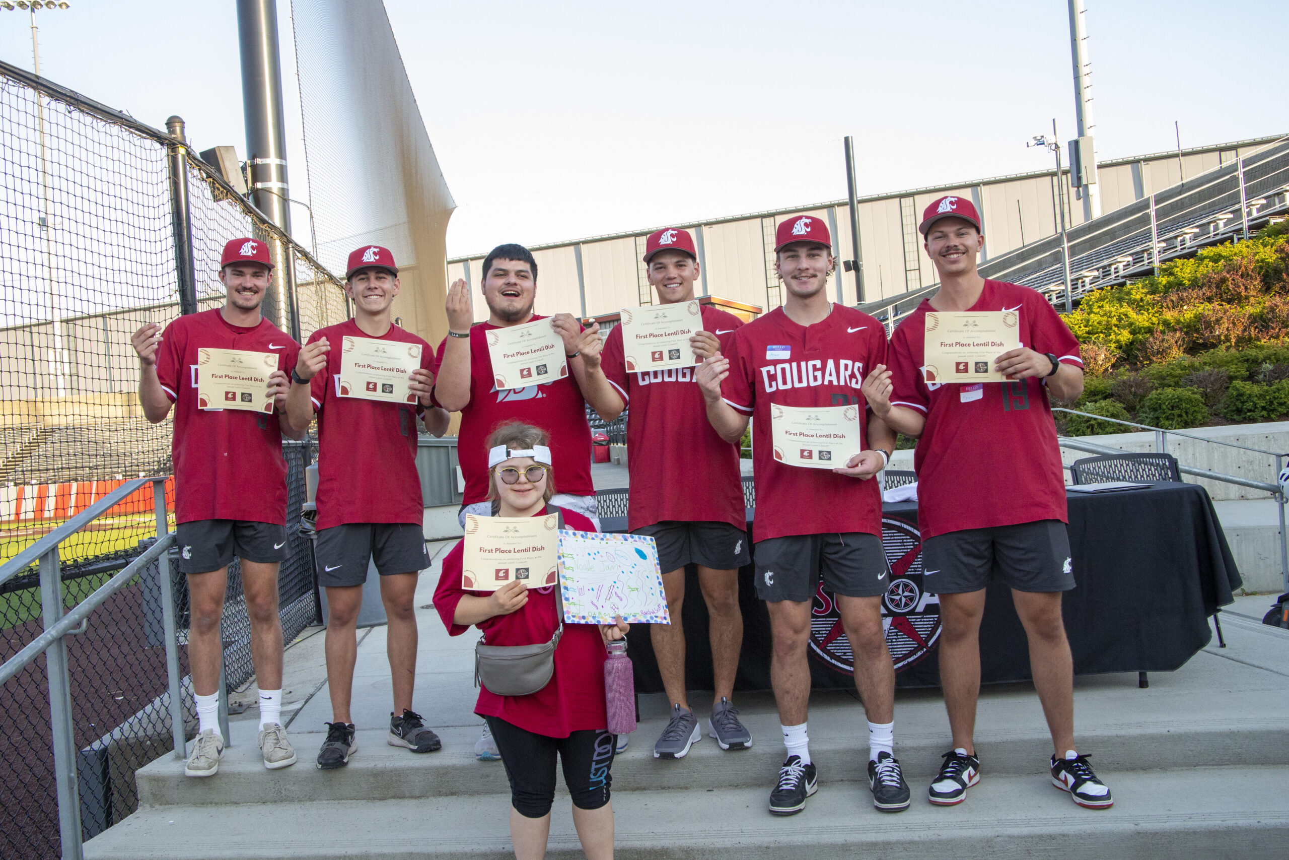 Players and WSU ROAR scholars all smile for camera