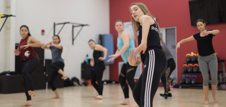 A photo of girls dancing in a gym
