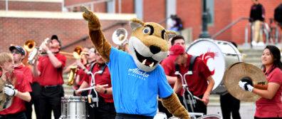 Mascot dances with band