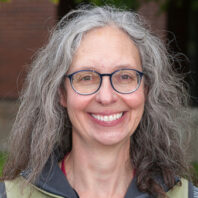 Susan Noh standing outside of the College of Veterinary Medicine.
