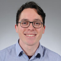 Professional headshot of Steven Winter in a photo studio.