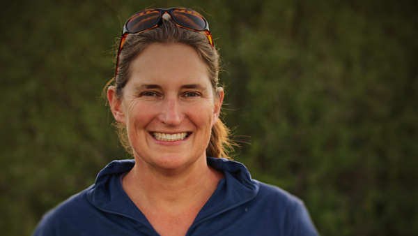 Kate Huyvaert outside, with sunglasses pulled back on her head.