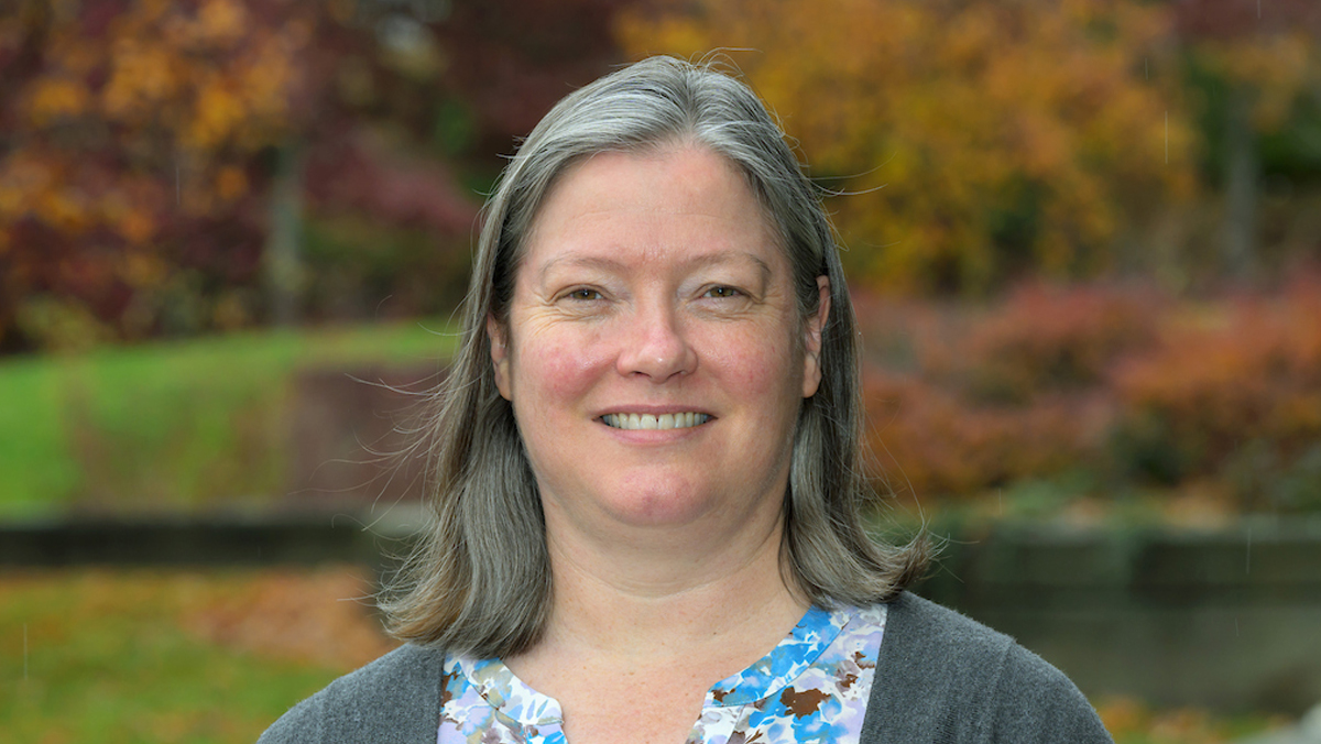 Dr. Matthew outside in the autumn.