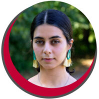 Tightly cropped photo of Reyhaneh. Her hair is pulled back tight.