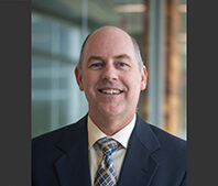 Jon Skare in a suite and a tie.