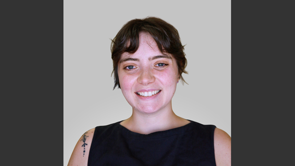 Jenna against a gray background.