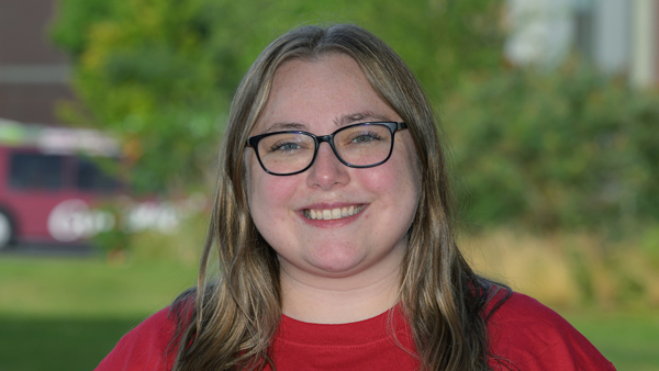 Caitlin, wearing a red shirt.