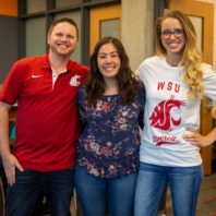 Three smiling people, two wearing WSU cougar shirts.