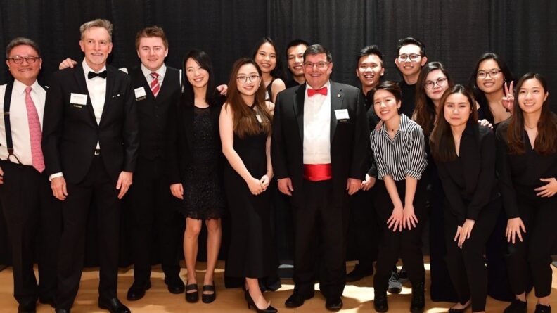 A large group of people in formal attire.