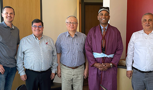 A group of people standing shoulder-to-shoulder.