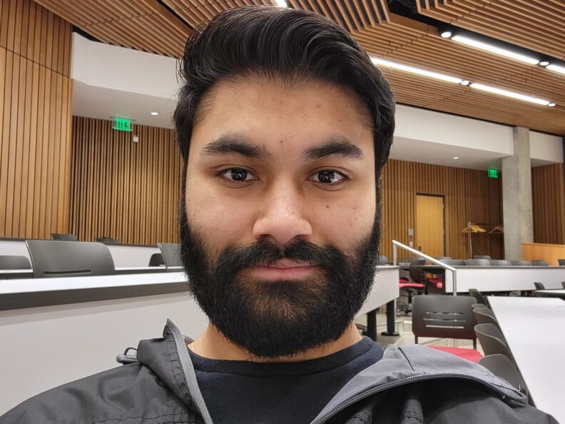 Karanveer Singh sitting in a classroom.