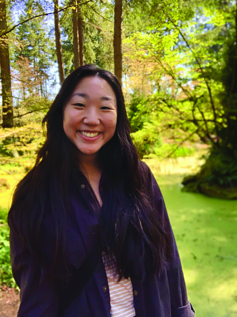 Marina de la Cruz standing outside surrounded by trees on a sunny day.