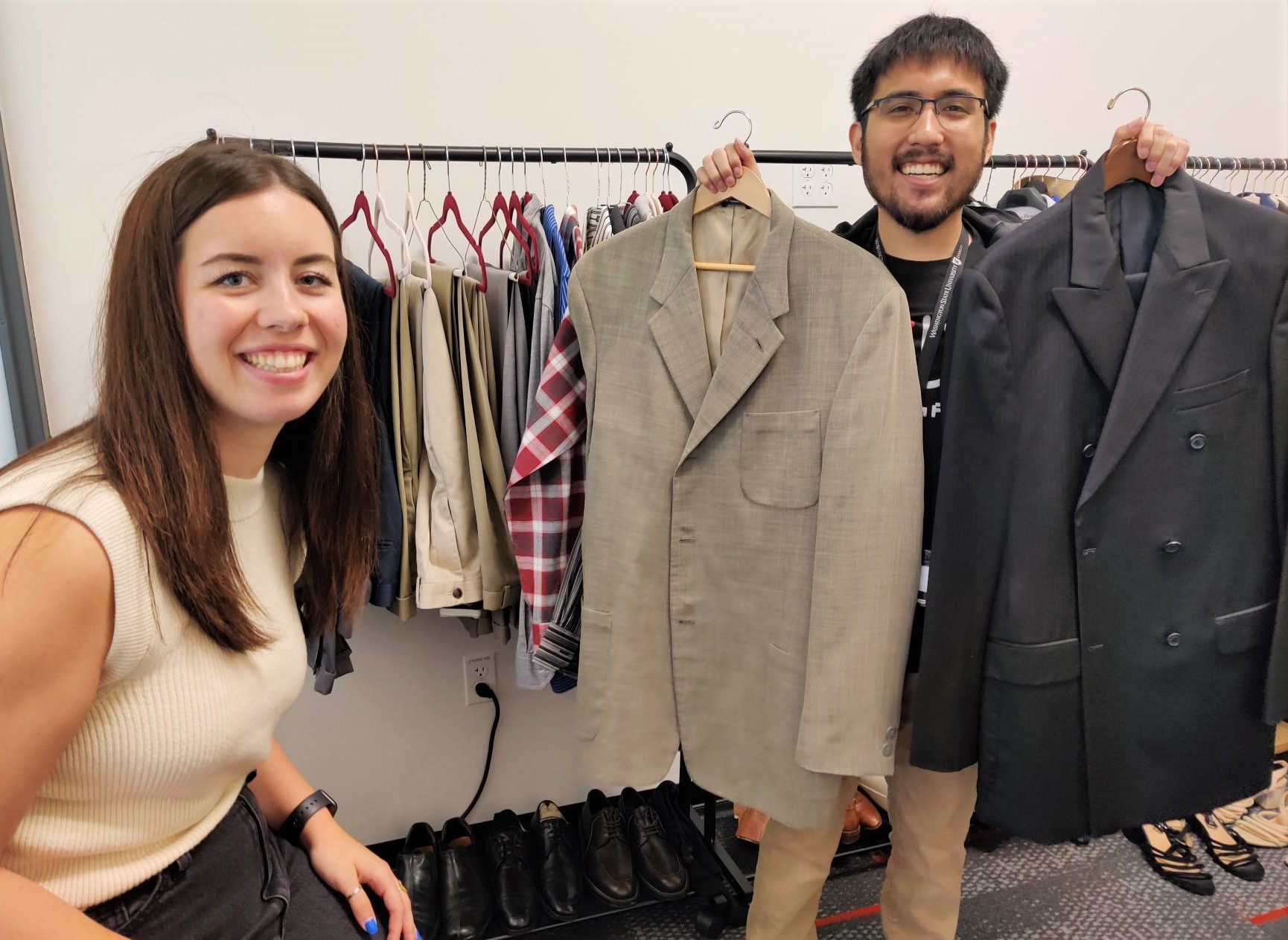 Closeup of a person wearing a college graduation hat with a cougar logo.