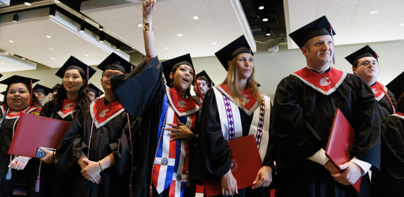 College students in graduation robes.