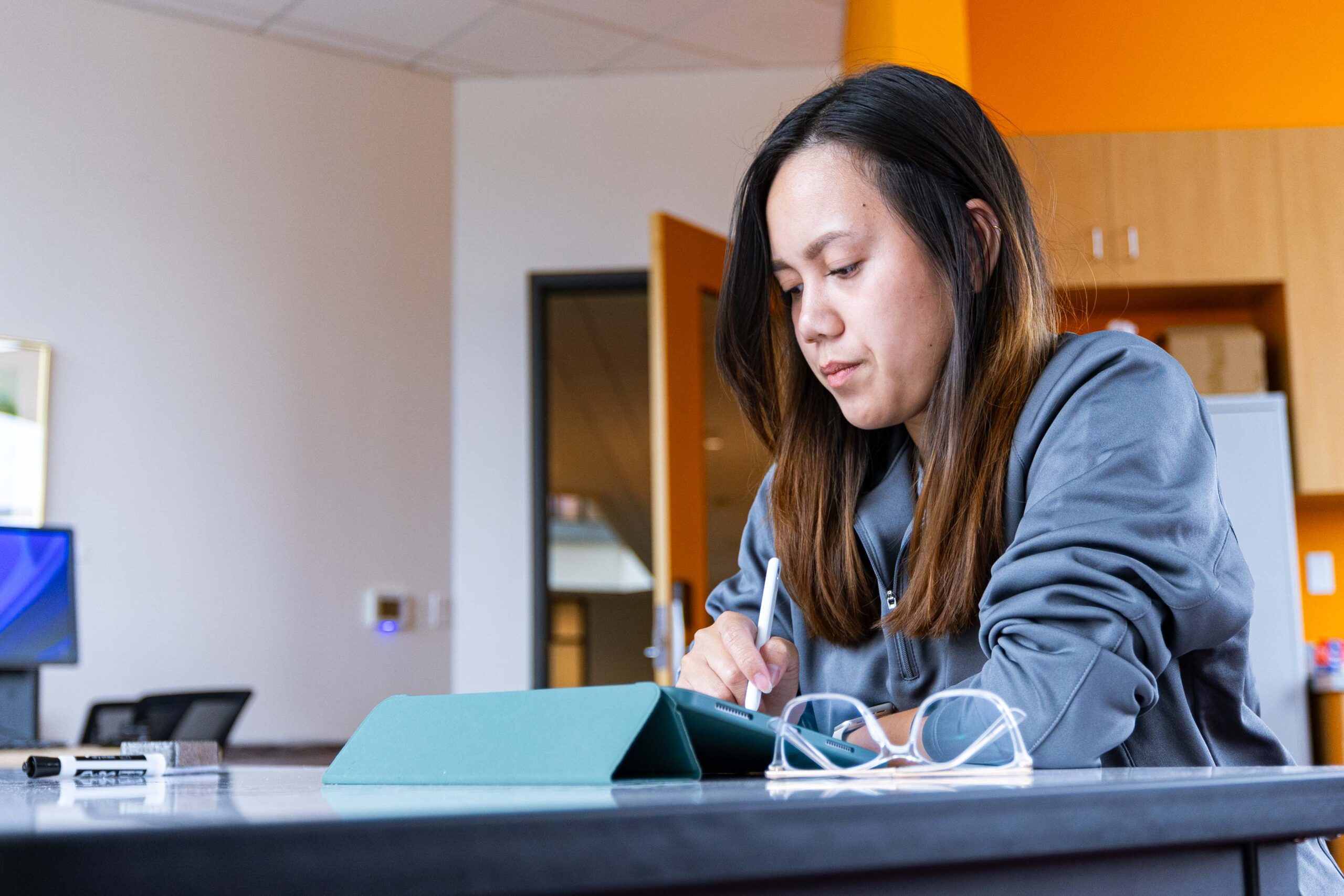 A student working on a tablet.
