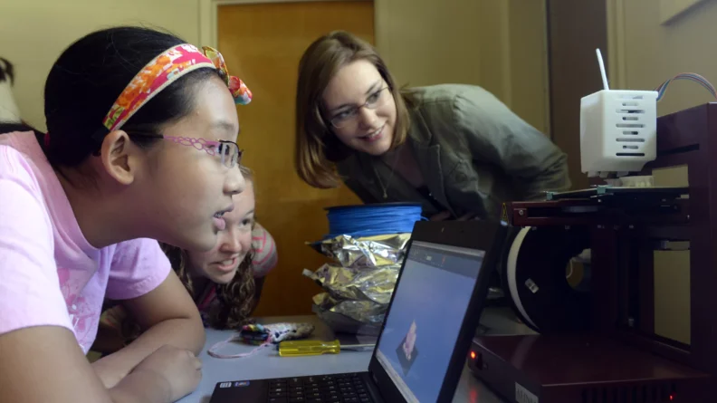 three kids with computer