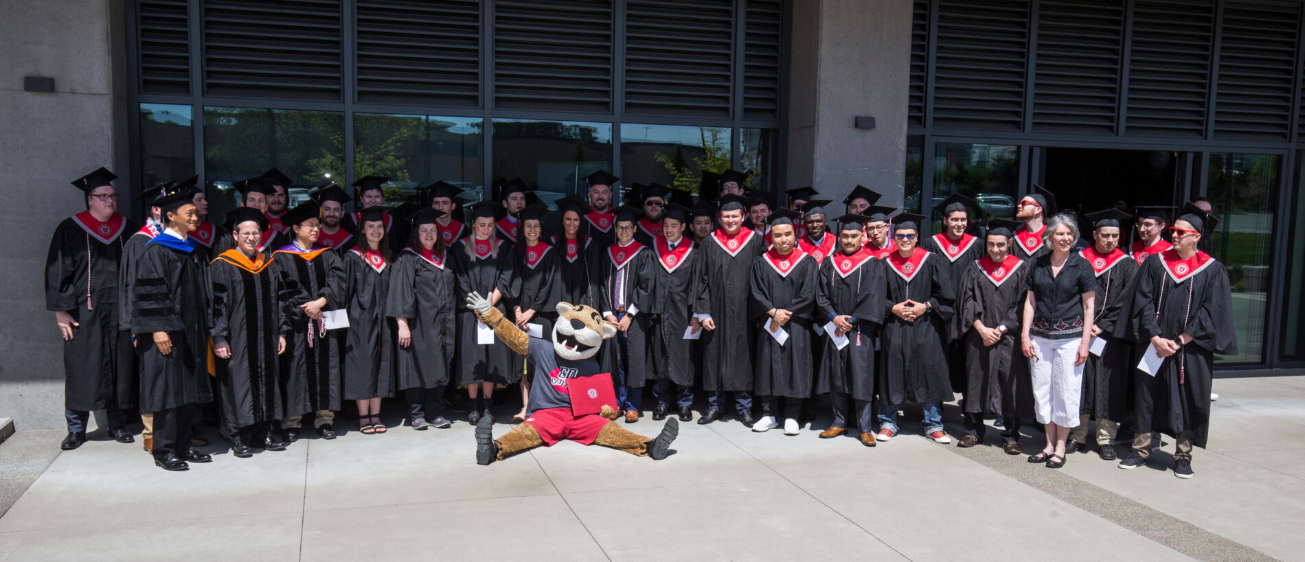 Many students in graduation robes.