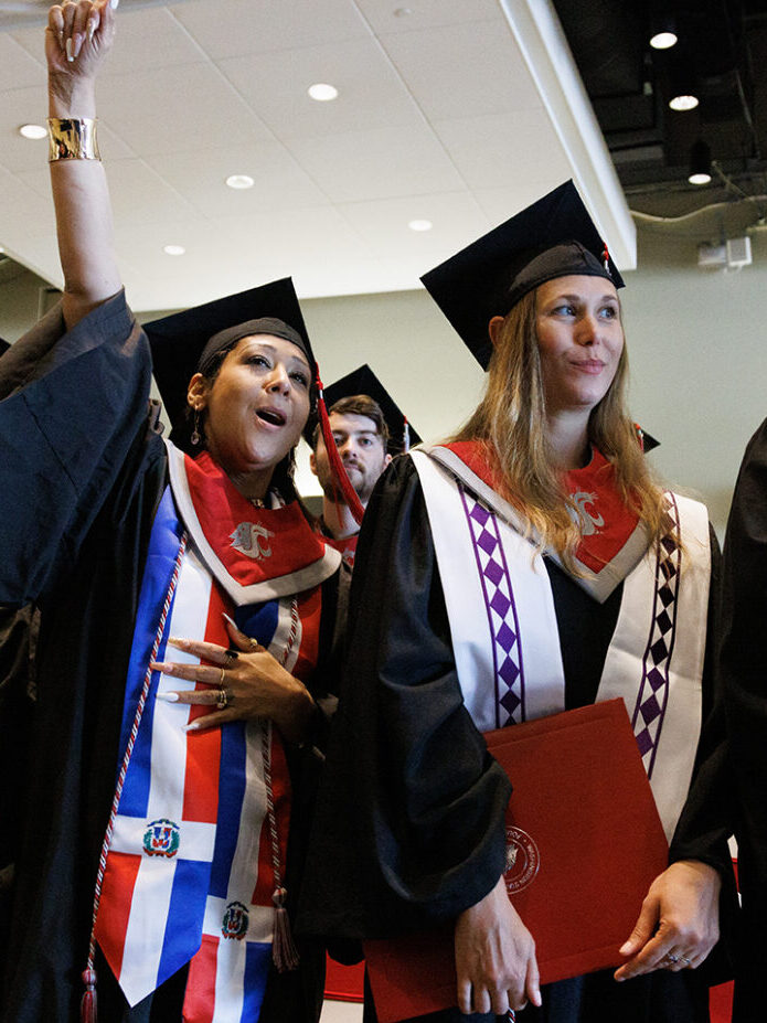 College students in graduation robes.