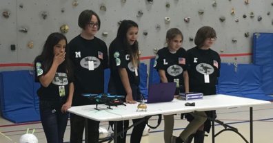 Five 4-H youth competing in a science competition.