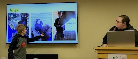 two youth giving a joint presentation.